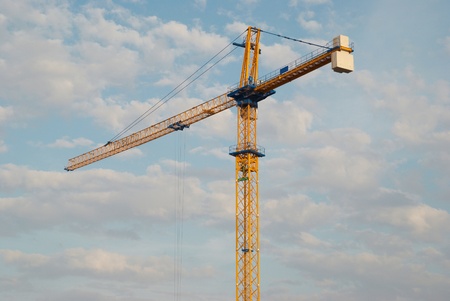 Building crane with the blue sky backgroundの写真素材