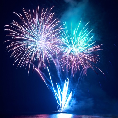 Colorful fireworks on the black sky backgroundの写真素材