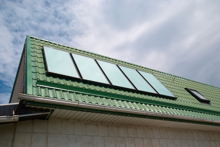 Solar water heating system on the roof の写真素材