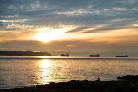 Sunset on the sea. Coastline and beautiful cloudscape.の写真素材
