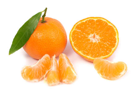 Orange mandarins with green leaf isolated on white backgroundの写真素材