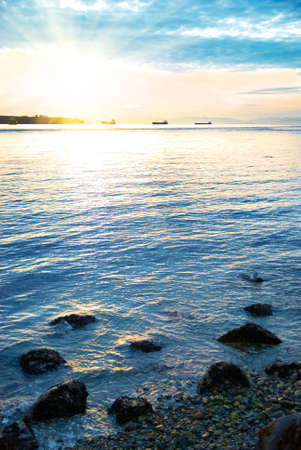 Sunset on the sea. Coastline and beautiful cloudscape.の写真素材