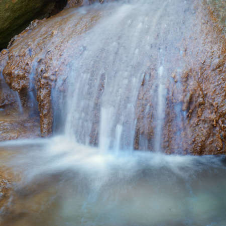Waterfall in the forest. Image of motion water flow の写真素材