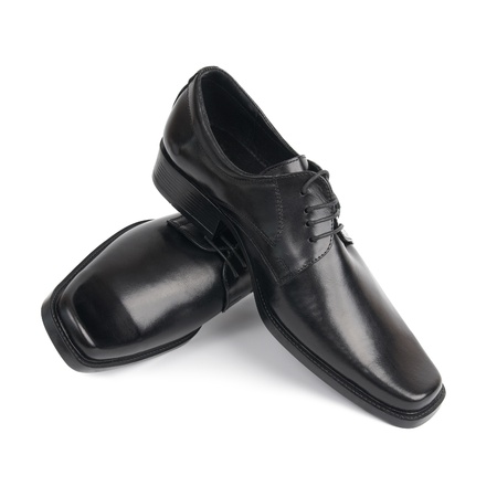 Pair of man's black shoes isolated on white backgroundの写真素材