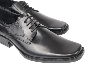 Pair of man's black shoes isolated on white backgroundの写真素材