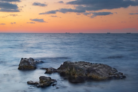 Sunset on the sea. Landscape with rocks and beautiful sky.の写真素材