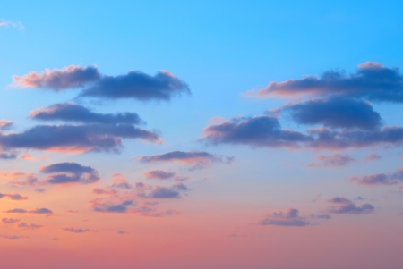 Romantic sunset with beautiful blue, red and yellow clouds の写真素材