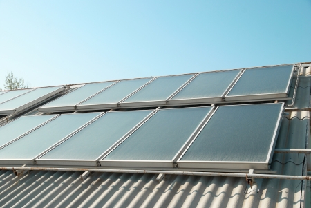 Solar water heating system on the red roof  Gelio panels の写真素材