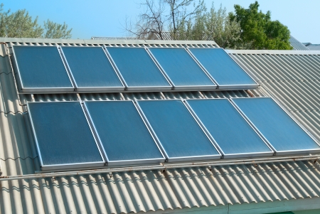 Solar water heating system on the red roof  Gelio panels の写真素材