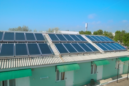 Solar water heating system on the red roof  Gelio panels の写真素材
