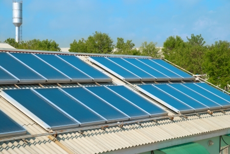 Solar water heating system on the red roof  Gelio panels の写真素材