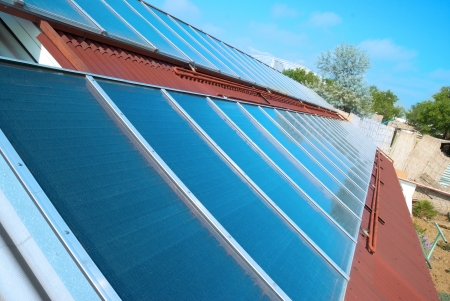 Solar water heating system on the red roof  Gelio panels の写真素材