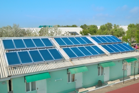 Solar water heating system on the red roof  Gelio panels の写真素材