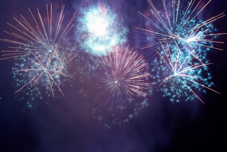Blue and purple colorful fireworks on the black sky background  Holiday celebration の写真素材