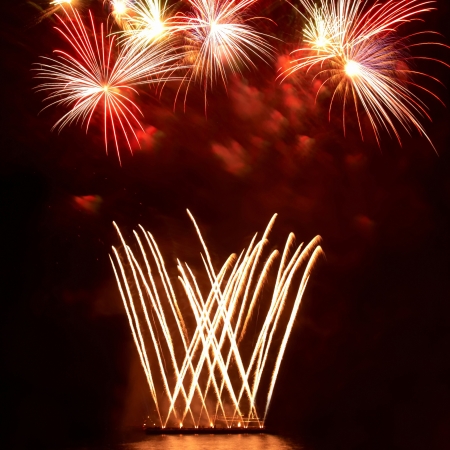 Colorful fireworks on the black sky backgroundの写真素材