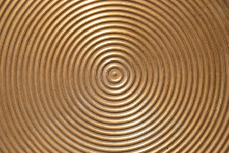 Abstract circle metal plate- golden surface with round lines の写真素材
