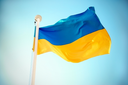 Ukrainian blue and yellow flag on the sky backgroundの写真素材