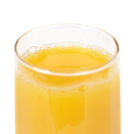 Glass of orange juice isolated on whiteの写真素材
