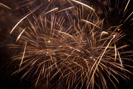 Colorful holiday fireworks on the black sky background.の写真素材