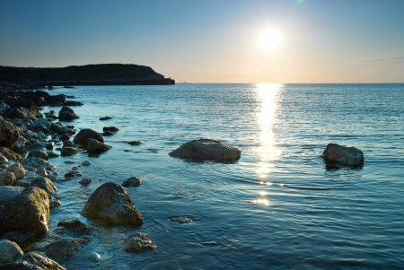 Sea shore and stones. Seascape at sunset.の写真素材
