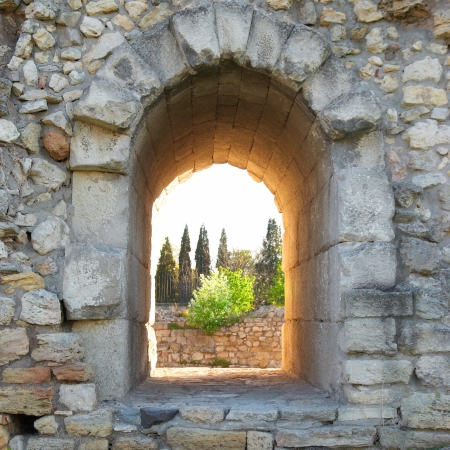 Exit in the ancient wall. Entrance to the green parkの写真素材