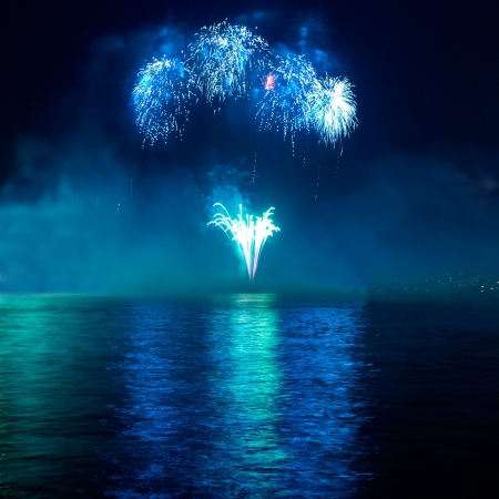 Colorful fireworks on the black sky backgroundの写真素材