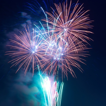 Colorful fireworks on the black sky backgroundの写真素材