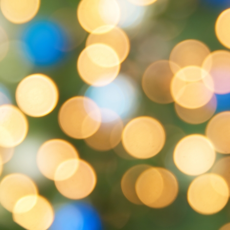 Holiday blue, yellow and green lights- christmas soft backgroundの写真素材