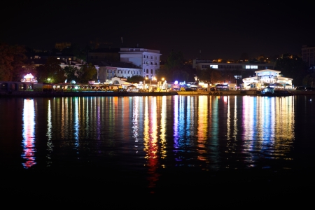Colorful city illumination at night. View from the seafrontの写真素材