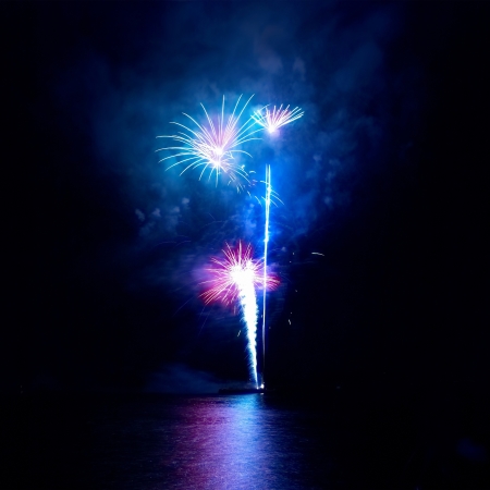 Colorful fireworks on the black sky backgroundの写真素材