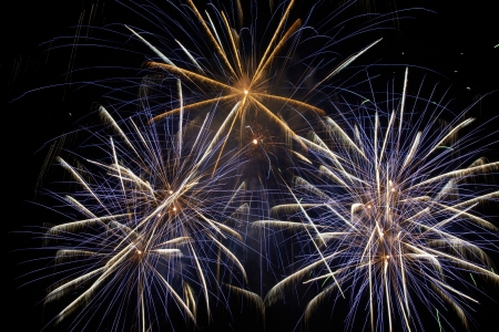 Blue colorful holiday fireworks on the black sky background.の写真素材