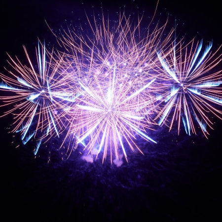 Blue colorful fireworks on the black sky backgroundの写真素材