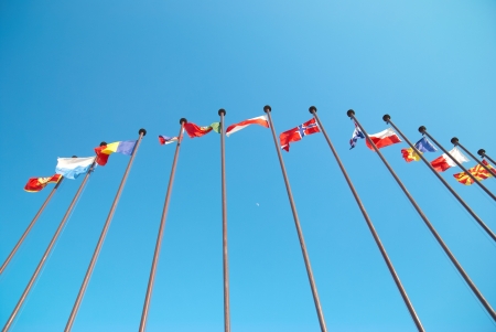 Row of european flags against blue sky backgroundの写真素材