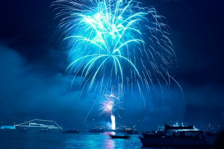Colorful blue fireworks on the black sky backgroundの写真素材
