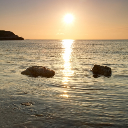 Sea shore and stones. Seascape at sunset.の写真素材