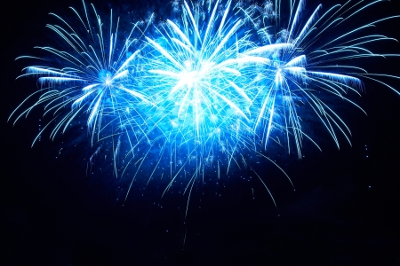 Blue colorful fireworks on the black sky backgroundの写真素材