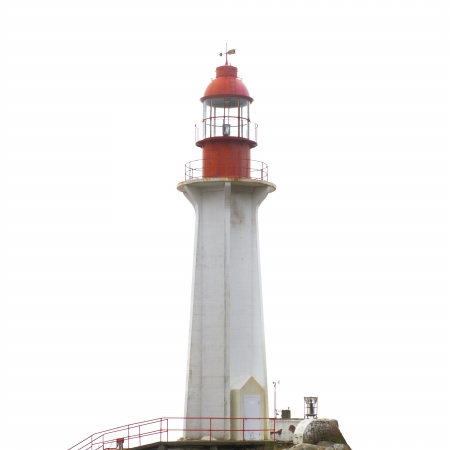 Lighthouse on the rock isolated on whiteの写真素材