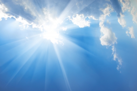 Beautiful blue sky with sunbeams and clouds  Sun rays の写真素材