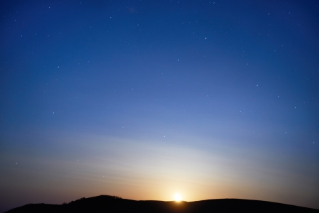 Blue dark night sky with many stars  Moon rising  Space backgroundの写真素材