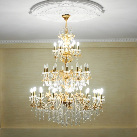 Beautiful crystal ancient chandelier in a hall  Lamp with soft yellow lightの写真素材