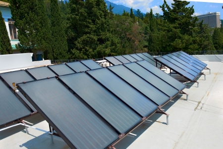 Solar water heating system on the red roof  Gelio panels の写真素材