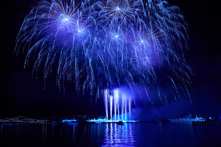 Blue colorful fireworks on the black sky backgroundの写真素材
