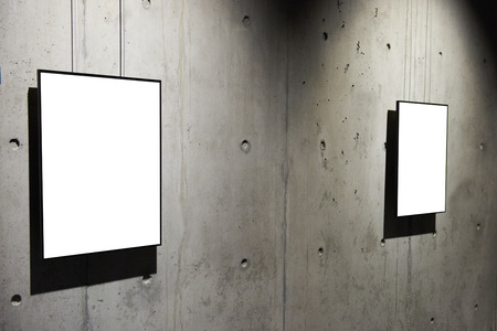 Empty white isolated frame on the wallの写真素材