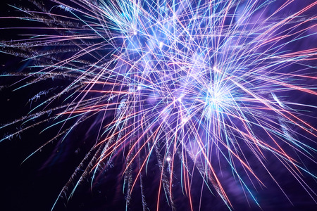 Blue colorful fireworks on the black sky backgroundの写真素材