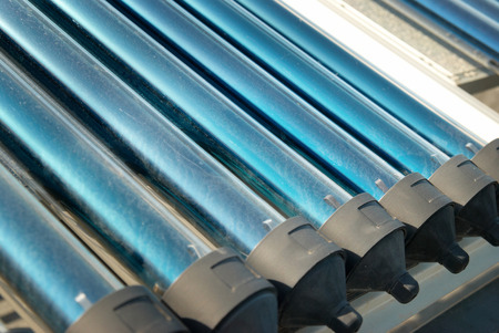 Vacuum solar water heating system on the house roof の写真素材