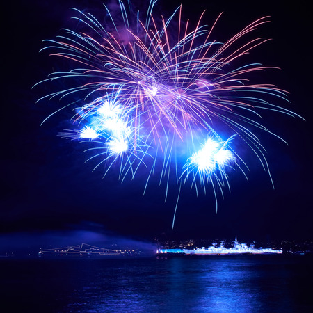 Blue colorful fireworks on the black sky backgroundの写真素材