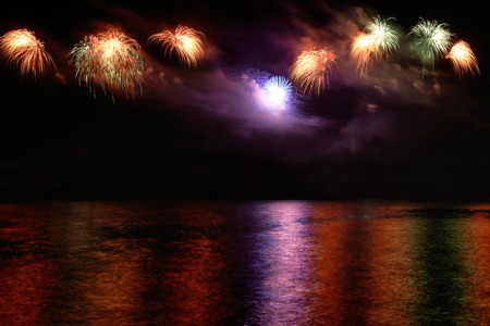 Colorful fireworks on the black sky backgroundの写真素材