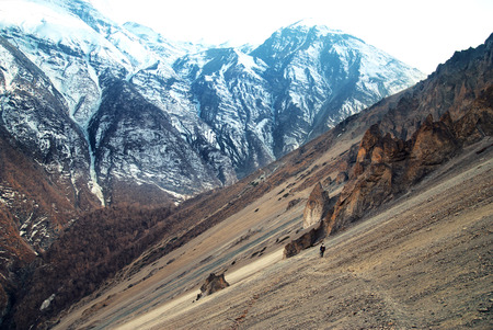 View of Himalayas mountains from Annapurna trek. Man standing on the pathの写真素材