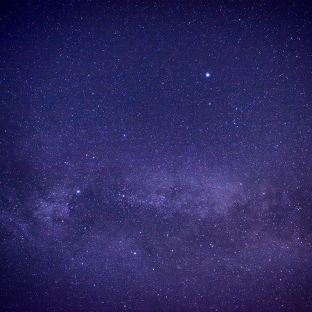 Purple dark night sky with many stars. Space milky way backgroundの写真素材