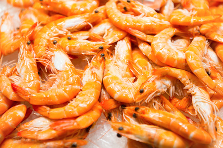 Pile of red fresh shrimps at the market. Seafood texture for backgroundの写真素材